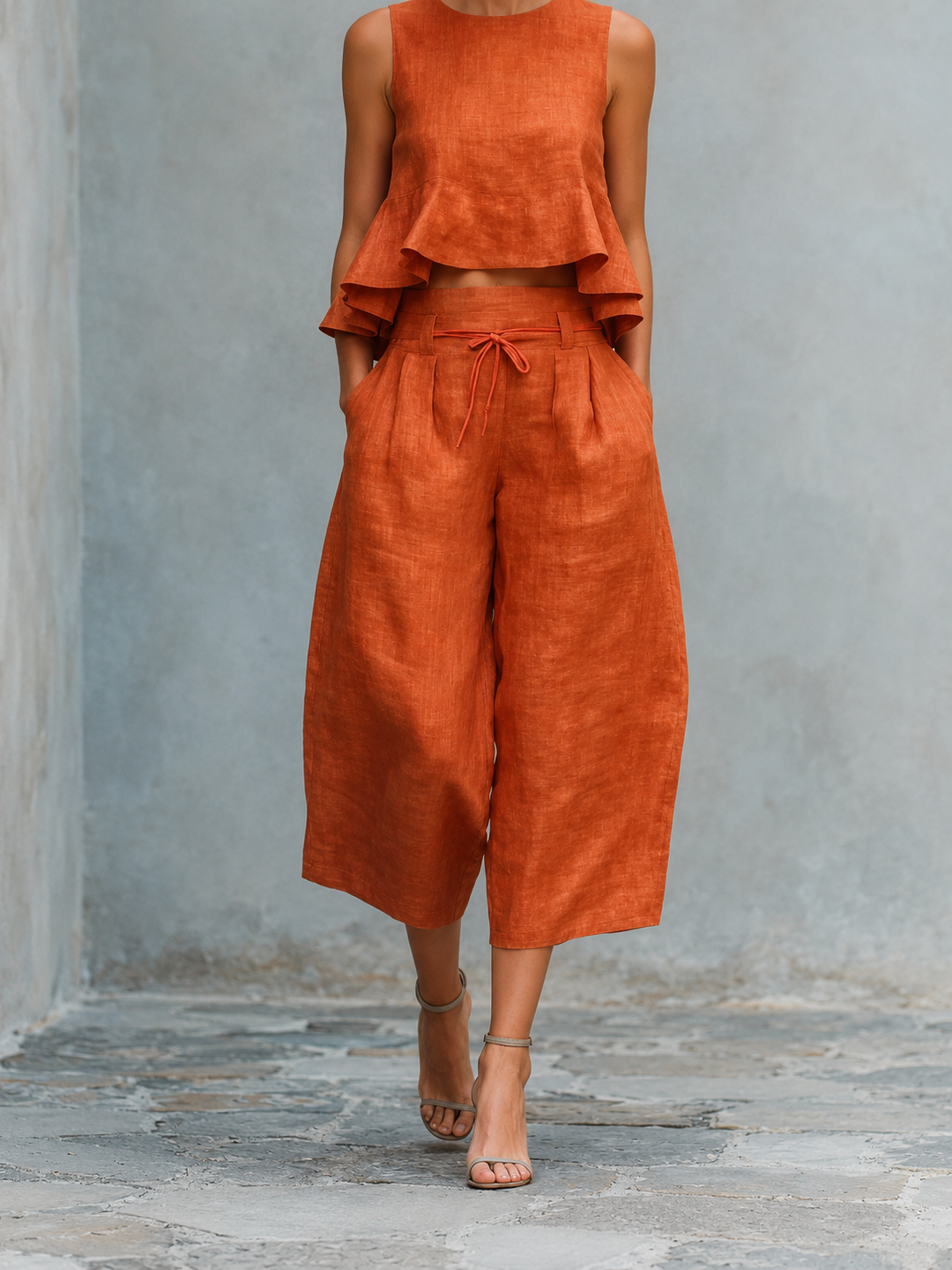 Conjunto mujer naranja: blusa sin mangas con volantes y pantalón amplio con lazo