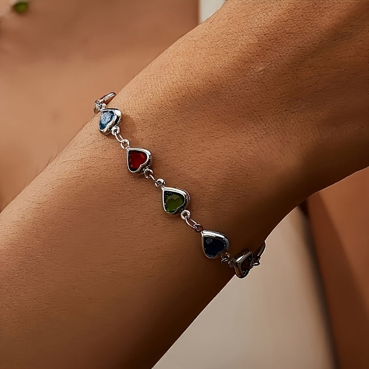 Pulsera Concepción™ con dijes de corazones en azul, rojo, verde y negro
