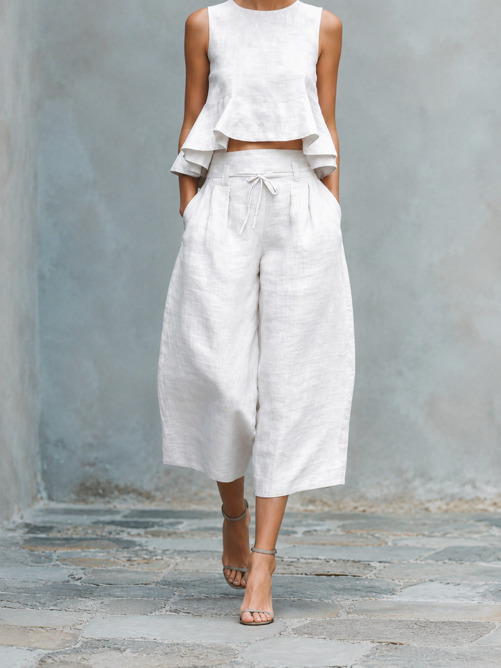 Conjunto mujer blanco: blusa sin mangas con volantes y pantalón amplio con lazo