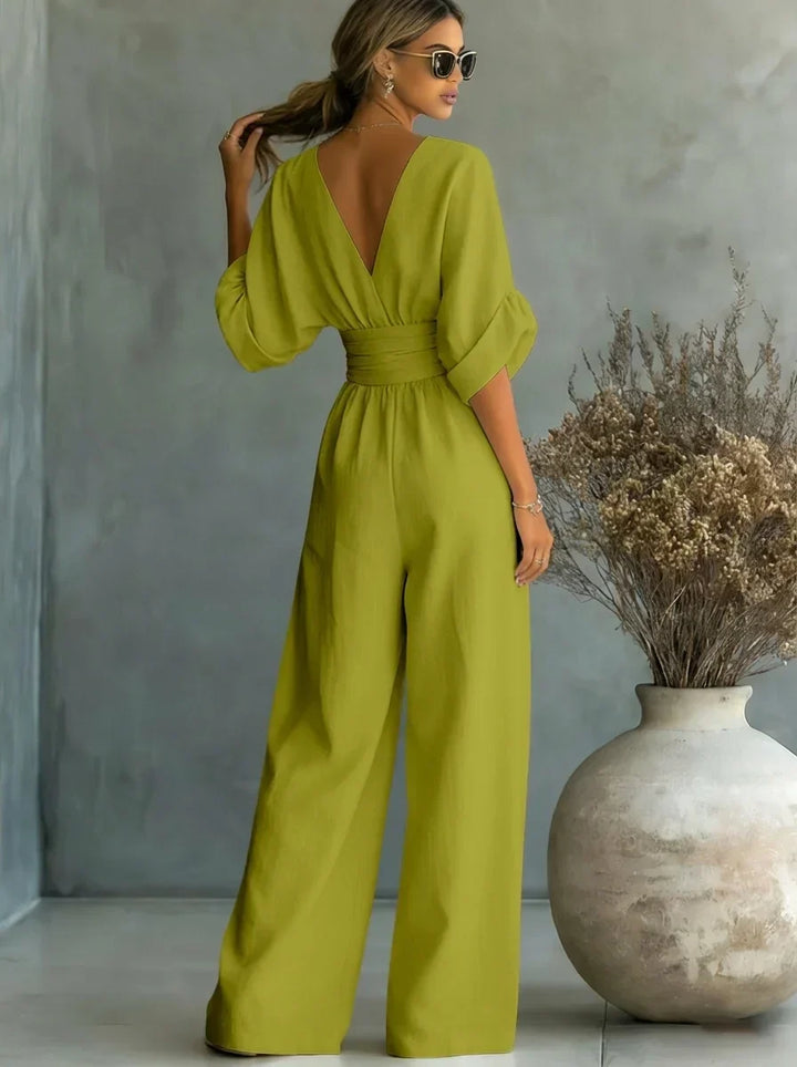 Mono verde oliva con escote en V, mangas abullonadas y pantalón ancho fruncido en la cintura