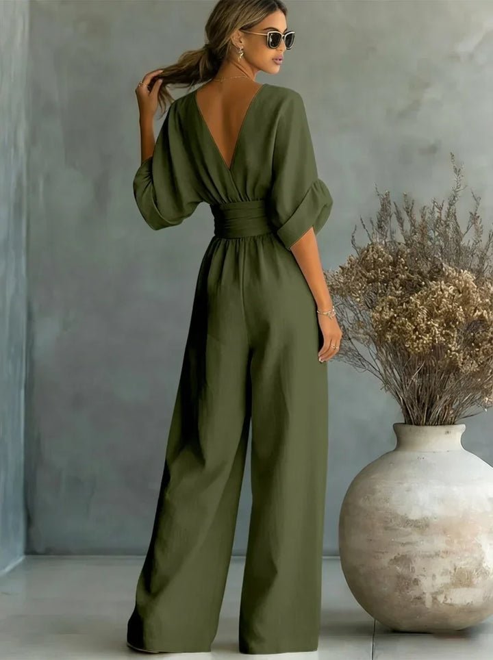 Mono verde oliva con escote en V, mangas tipo globo y pantalón ancho con cintura fruncida