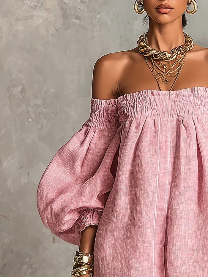 Vestido mini rosa con hombros descubiertos y mangas farol, tela con textura ligera