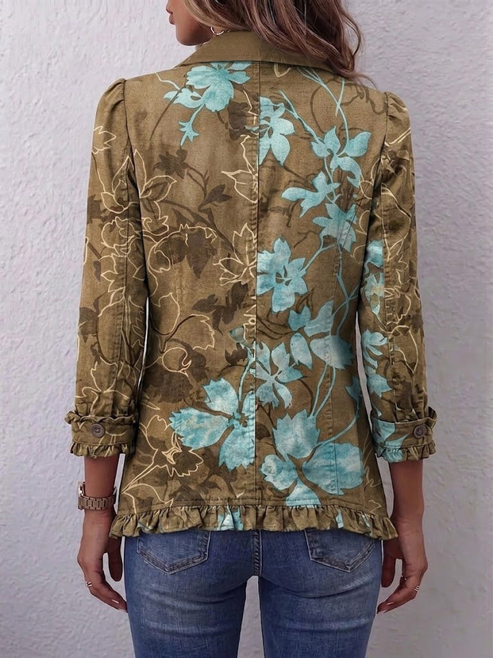 Chaqueta floral degradada oliva y turquesa por detrás, con botones y puños fruncidos